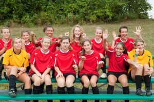 Girls soccer team portrait outdoors