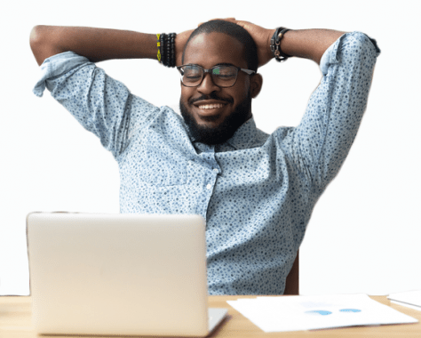 man relaxing in front of laptop with hands folded behind his head after using Equidox software to remediate PDFs