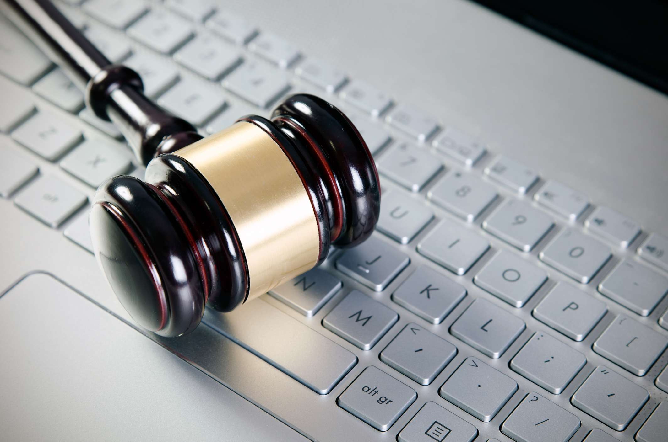 Gavel on a keyboard, symbolizing digital accessibility lawsuits.