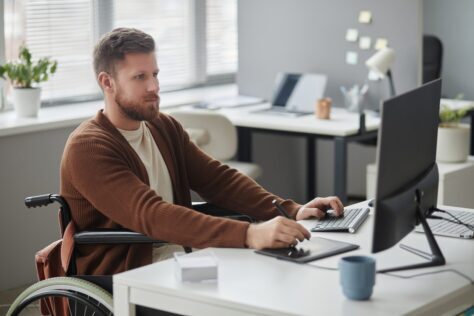 man in wheelchair working on PDF remediation