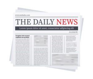 Newspaper with headline and multiple columns of text