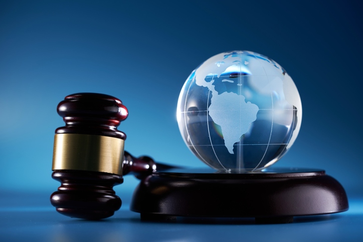 Gavel and glass globe.